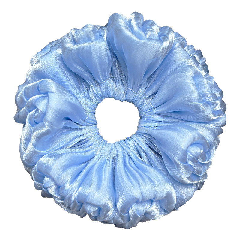 Single blue organza cloud scrunchie isolated on white background. Ultra-voluminous ruffled design with petal-like edges and subtle ribbed organza sheen.