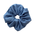 Front view of a blue gingham cotton scrunchie, classic checkered hair tie with no-crease hair protection.