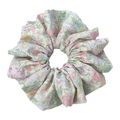 Front view of a vibrant dopamine floral scrunchie on white background, no-crease hair protection in multi-color.
