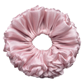 Single petal pink organza cloud scrunchie isolated on white background. Ultra-voluminous ruffled design with soft petal-like edges and subtle ribbed organza sheen.